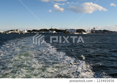 Scenery and wake of a tourist boat touring Yokosuka Naval Port in Yokosuka City, Kanagawa Prefecture Scenery and wake of a tourist boat touring Yokosuka Naval Port in Yokosuka City, Kanagawa Prefecture 123491656