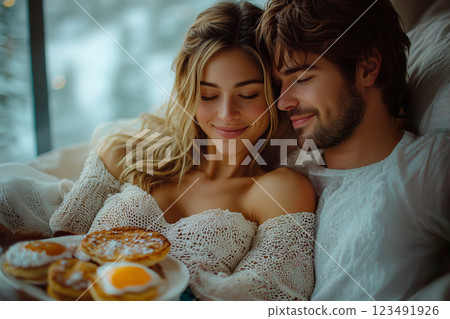 Happy breakfast for couple relaxing in bed 123491926