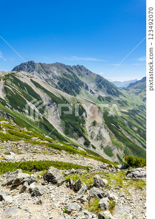 View of the three Tateyama mountains, Mt. Oyama, Mt. Onamuji, and Mt. Fujinooritate from Betsuyama Norikoshi. Climbing Mount Tsurugi in the Northern Alps. 123492070