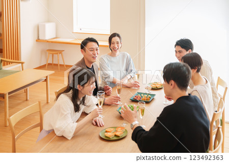 Men and women having a home party 123492363