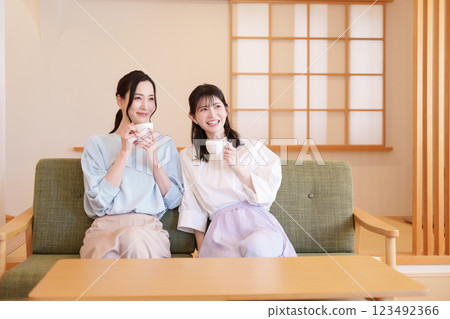 Middle-aged woman having a girls' night out Middle-aged woman having a girls' night out 123492366