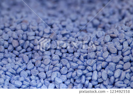 The pile of blue pellets materials for plastic injection process. 123492558
