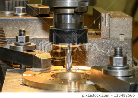 The hole boring process the brass material parts on NC milling machine with flat end mill tools. The hole boring process the brass material parts on NC milling machine with flat end mill tools. 123492560