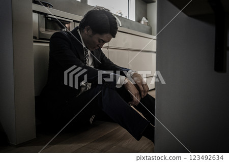 A businessman who came home tired and exhausted from overtime work (thinking, despair, frustration, hard work) A businessman who came home tired and exhausted from overtime work (thinking, despair, frustration, hard work) 123492634