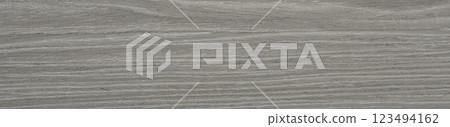 A serene expanse of ash veneer unfolds in shades of slate gray and silver, offering a modern, minimalist appeal A serene expanse of ash veneer unfolds in shades of slate gray and silver, offering a modern, minimalist appeal 123494162
