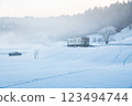 Ojiya City, Niigata Prefecture, Iiyama Line: A single-car train running through the snowy fields of fog and morning glow 123494744