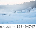Ojiya City, Niigata Prefecture, Iiyama Line: A single-car train running through the snowy fields of fog and morning glow 123494747