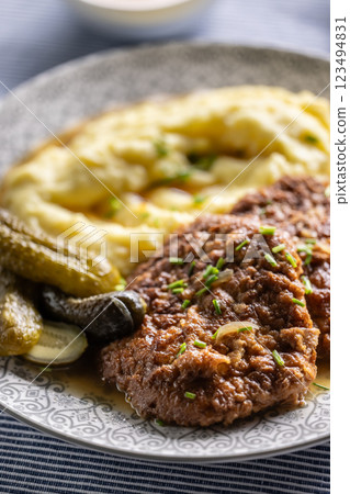 Inverted Beef Schnitzel with Mashed Potatoes and Pickled Cucumbers. Traditional Czech and Slovak Food 123494831