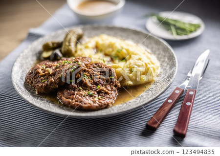Inverted Beef Schnitzel with Mashed Potatoes and Pickled Cucumbers. Traditional Czech and Slovak Food 123494835