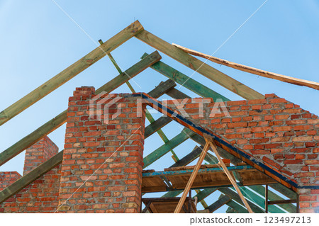 Construction of a modern house. Roofing works 123497213
