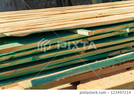 Boards for construction. Stacked boards close-up 123497214