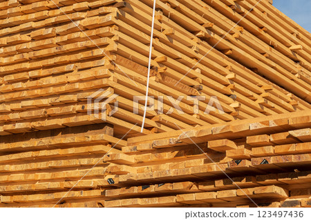 Wooden planks at lumber warehouse. Woodworking industry. Wooden boards Wooden planks at lumber warehouse. Woodworking industry. Wooden boards 123497436