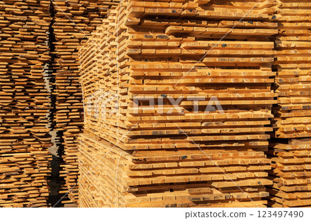 The boards are stacked. Drying wood on a sawmill. Wooden planks. Production of boards 123497490