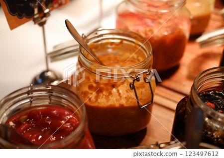Delicious Homemade Sauces in Glass Jars Delicious Homemade Sauces in Glass Jars 123497612