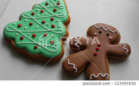 Shortbread Cookies In Shape Of Funny Man And Pine Tree On White Surface Angle View  123497630