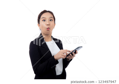 Portrait young asian businesswoman in suit gesture surprised while looking smartphone isolated. 123497947