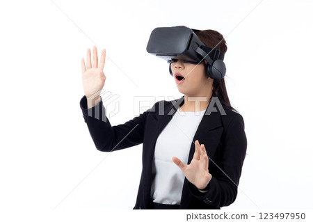 Portrait young asian businesswoman wearing headset virtual reality for device with experience. Portrait young asian businesswoman wearing headset virtual reality for device with experience. 123497950