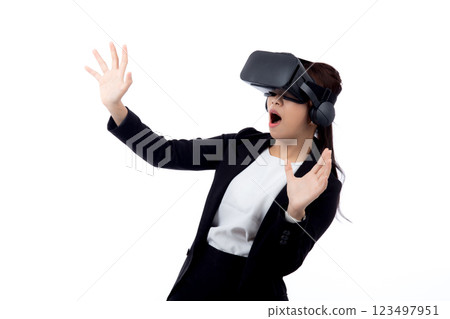 young asian businesswoman wearing headset virtual reality for device. young asian businesswoman wearing headset virtual reality for device. 123497951