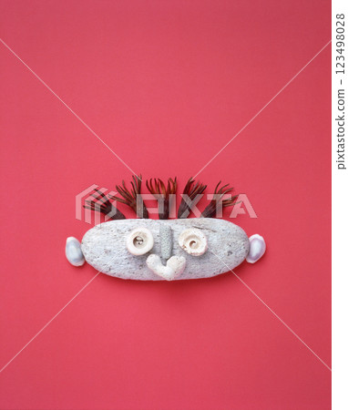 Expressive stone characters drawn with natural materials Expressive stone characters drawn with natural materials 123498028