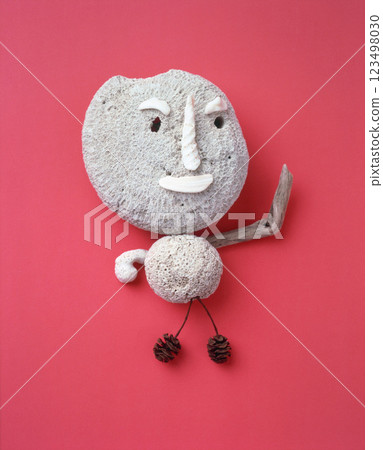 Expressive stone characters drawn with natural materials Expressive stone characters drawn with natural materials 123498030