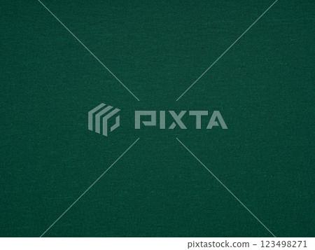 A close-up shot captures the sophisticated simplicity of a dark green paper surface with inviting texture and depth A close-up shot captures the sophisticated simplicity of a dark green paper surface with inviting texture and depth 123498271
