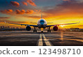 A large passenger jet sitting on top of an airport runway 123498710