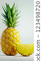A pineapple with a slice cut in half next to it 123498720
