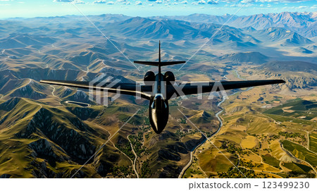 A plane flying over a mountain range with a river running through it 123499230