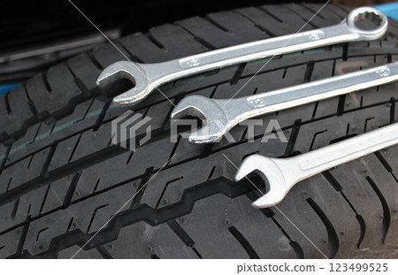 Variety Size Hex Spanners On A Car Tire Surface Variety Size Hex Spanners On A Car Tire Surface 123499525