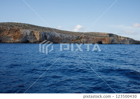 Elephant rock and Santa Maria caves cliffs on Malta view from yacht 123500430