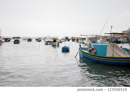 Many fishers boats moored in Marsaxlokk bay on Malta Many fishers boats moored in Marsaxlokk bay on Malta 123500529