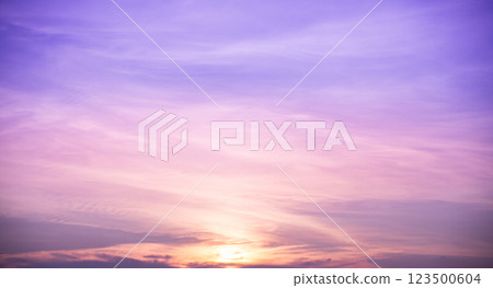 Beautiful dramatic scenic after sunset sky background after sunset, luxury soft gradient orange gold clouds and sunlight on the blue sky perfect for the background 123500604