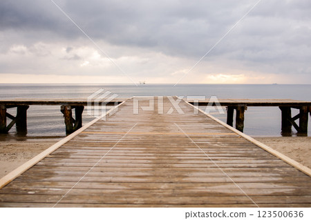 Way to the sea on wooden pier in Baltic sea in Sopot, Poland 123500636