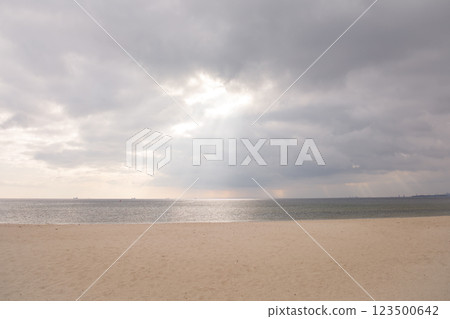 Empty beach by the Baltic Sea in cloudy weather in Sopot, Poland 123500642