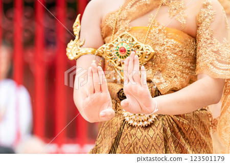 Close up hand of Thai folk dance during celebration on temple background. Thai traditional dance on event celebration. 123501179