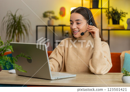 Woman freelance worker call center or support service operator helpline having talk with client 123501421