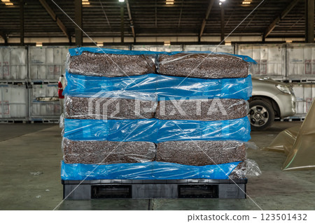 Natural rubber packaged in the plastic sacks, prepared for export delivery, at the distribution center of a rubber company. Natural rubber packaged in the plastic sacks, prepared for export delivery, at the distribution center of a rubber company. 123501432