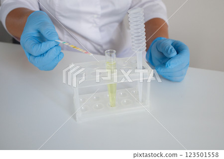 Urinalysis or urine test with express strips in clinical laboratory 123501558