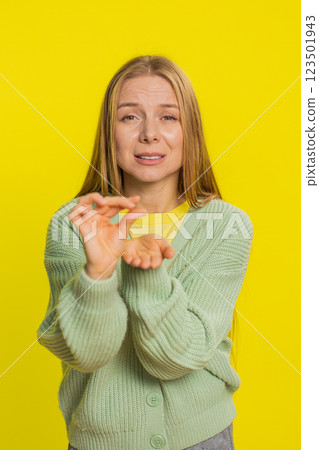 Woman show a little bit gesture begging help need some more please give me measuring small size 123501943