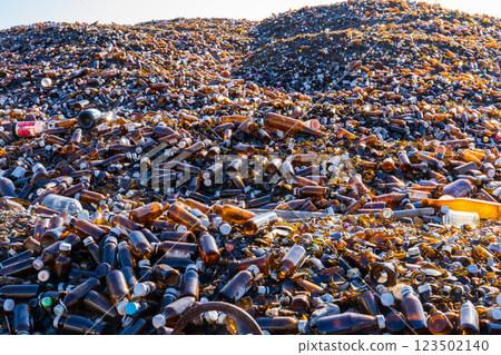 Mountains of empty brown bottles - Recycling 123502140