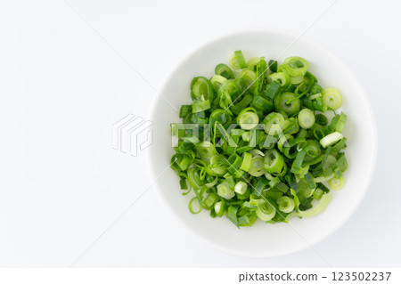 Chopped green onions in a small dish (green onions) Chopped green onions in a small dish (green onions) 123502237