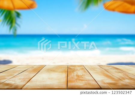 Wood table top on blurred blue sea and white sand beach background can be used for display or montage your products 123502347