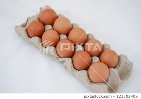 Eggs in a carton box 123502409