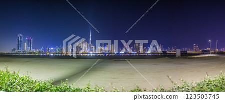 Stunning view of Dubai skyline at night featuring Burj Khalifa and city lights Stunning view of Dubai skyline at night featuring Burj Khalifa and city lights 123503745