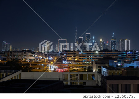 Stunning view of Dubai skyline at night featuring Burj Khalifa and city lights 123503753