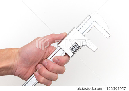 Hand holding a motor wrench Hand holding a motor wrench 123503957
