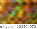 A vibrant, multicolored holographic surface featuring a pattern of raised diamond shapes, reflecting light and creating a dynamic visual effect. 123504072