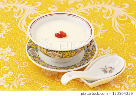 Almond tofu made in a yellow Chinese bowl on a yellow fabric background Almond tofu made in a yellow Chinese bowl on a yellow fabric background 123504339