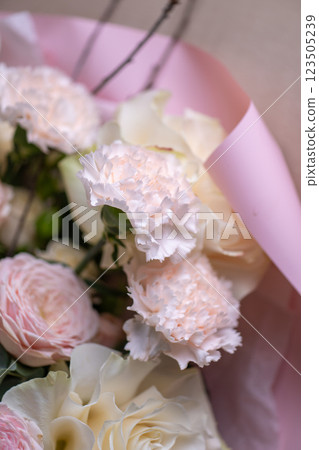 Delicate composition of white and pink roses in a basket 123505239