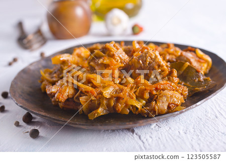 Stewed or braised cabbage served on dark plate 123505587